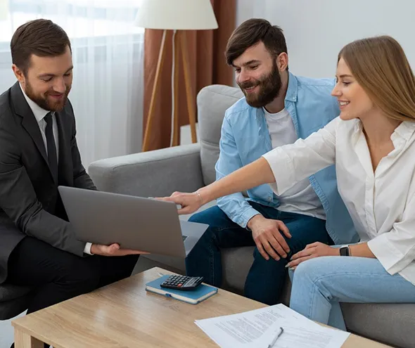 Trusted small business owners discuss coverage plans with an insurance agent for comprehensive business protection.